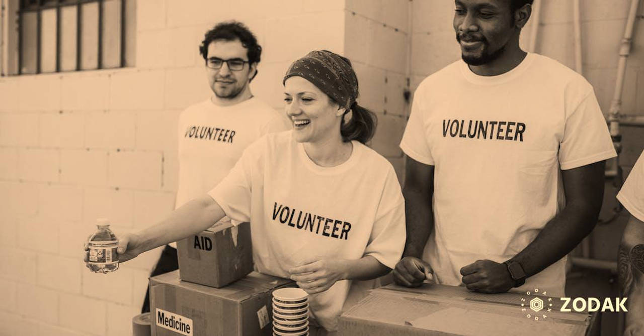 Three People Donating Goods