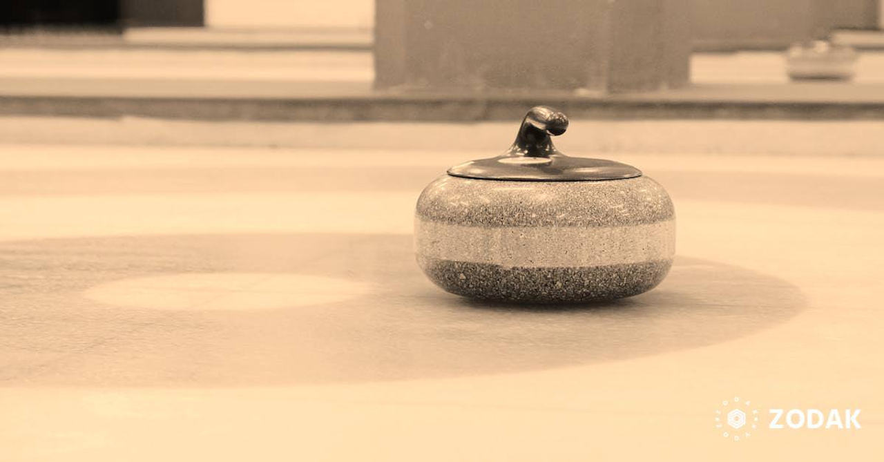 Curling stone on ice sheet