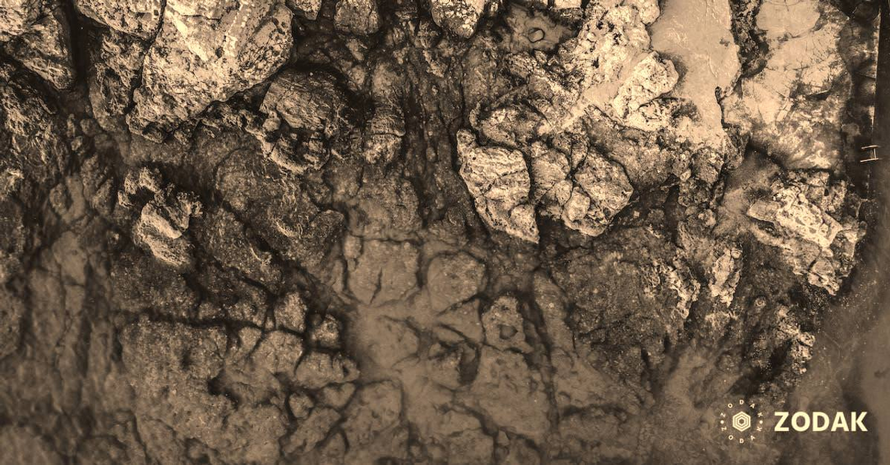 Aerial Photography of Rocks Beside Body of Water