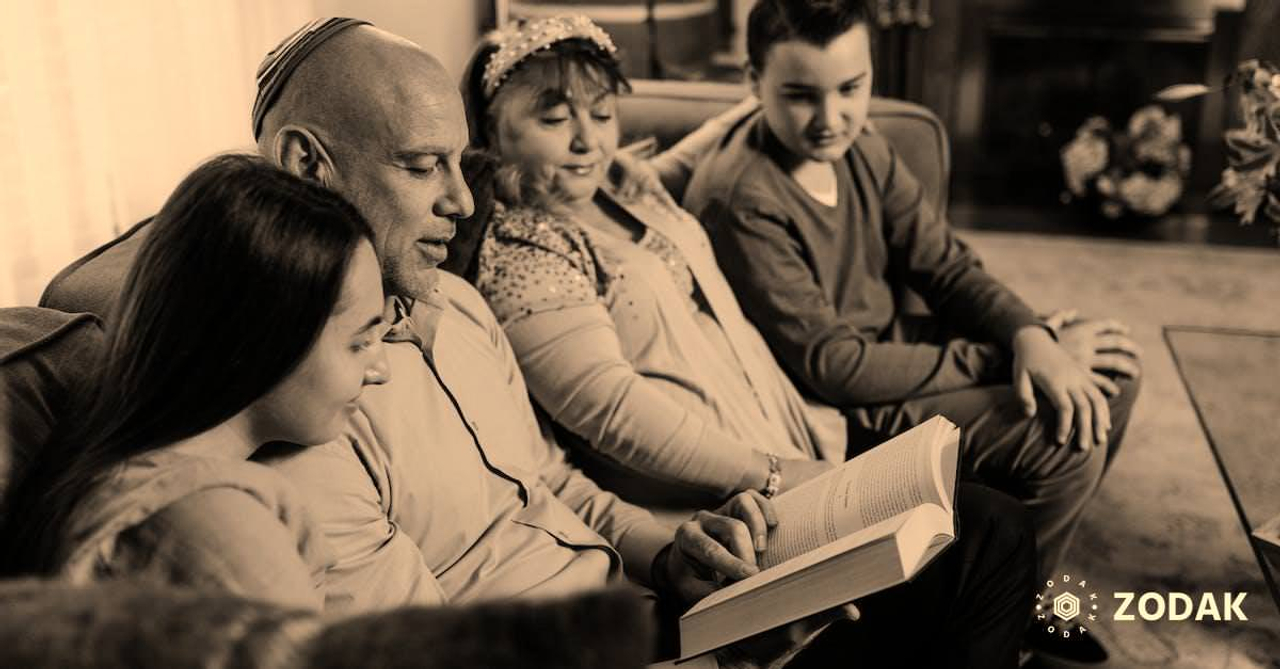 Photo Of Famly Looking In The Book 