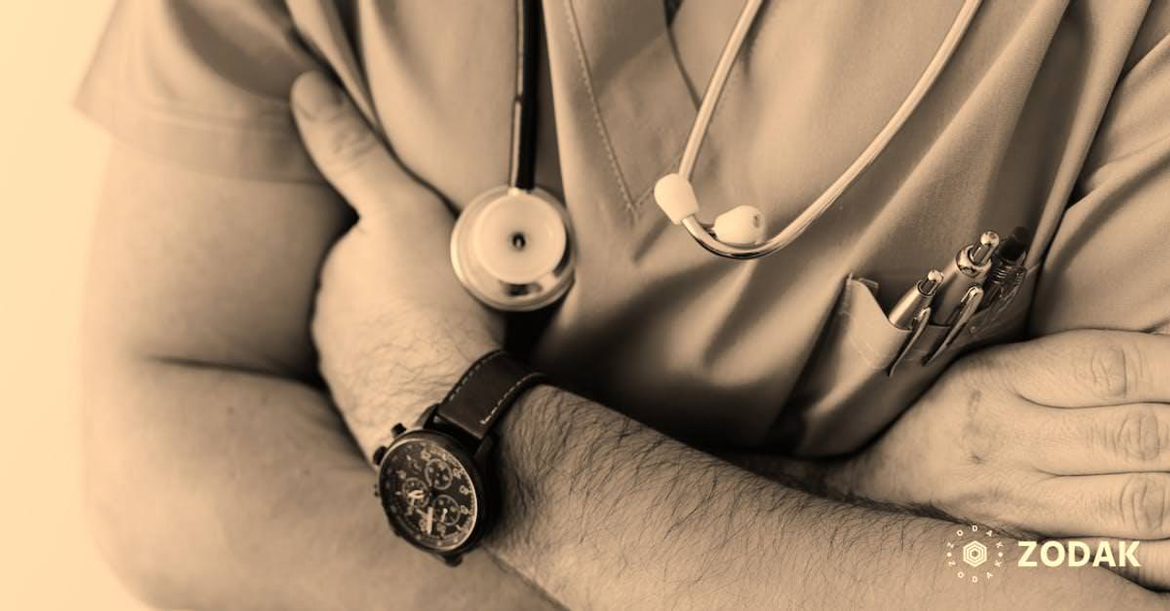 Crop doctor with stethoscope in hospital