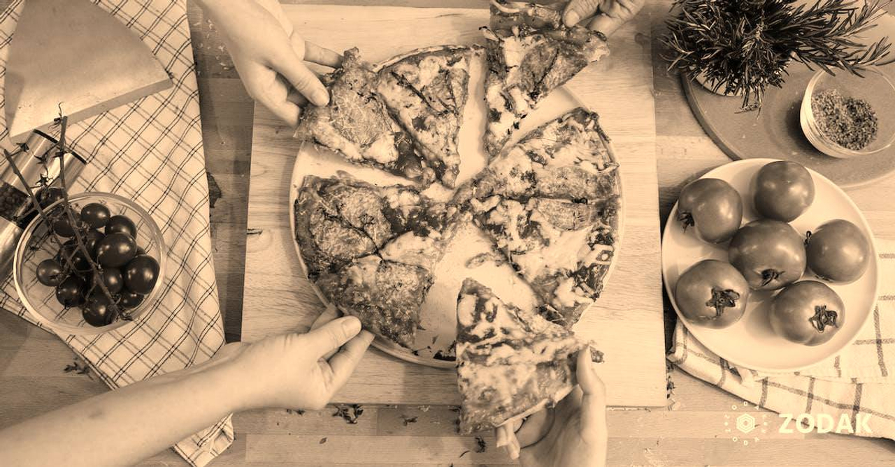 Crop friends taking slices of delicious pizza from cutting board