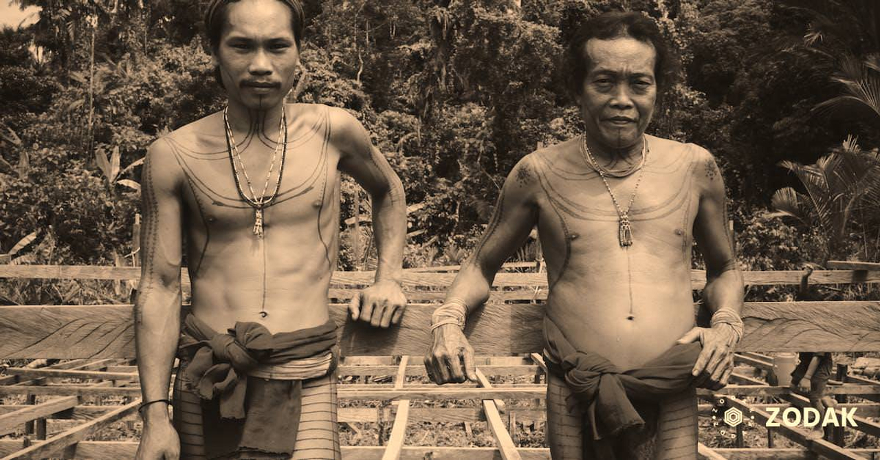 Two Men Wearing Red Tribal Clothing