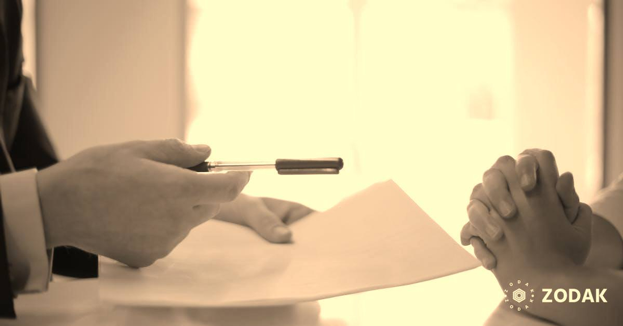 Crop businessman giving contract to woman to sign