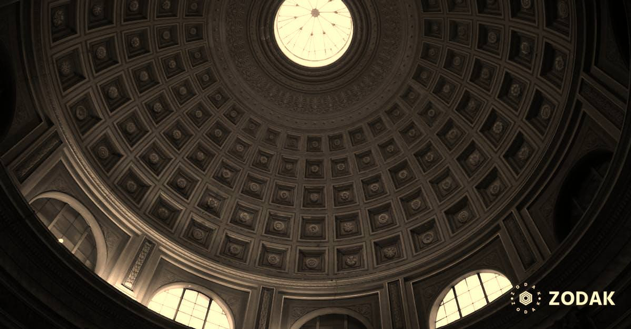 From below of black and white ornamental dome of Round Hall located in Vatican Museums