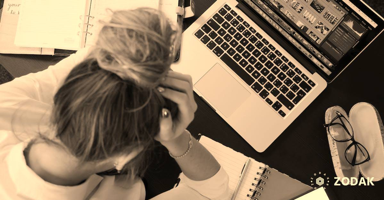 Woman Sitting in Front of Macbook