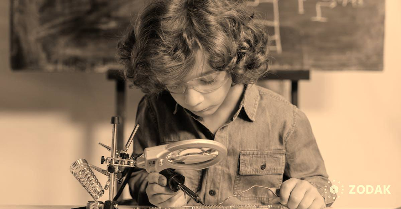 Close-Up Photo of a Smart Boy Doing a Science Experiment