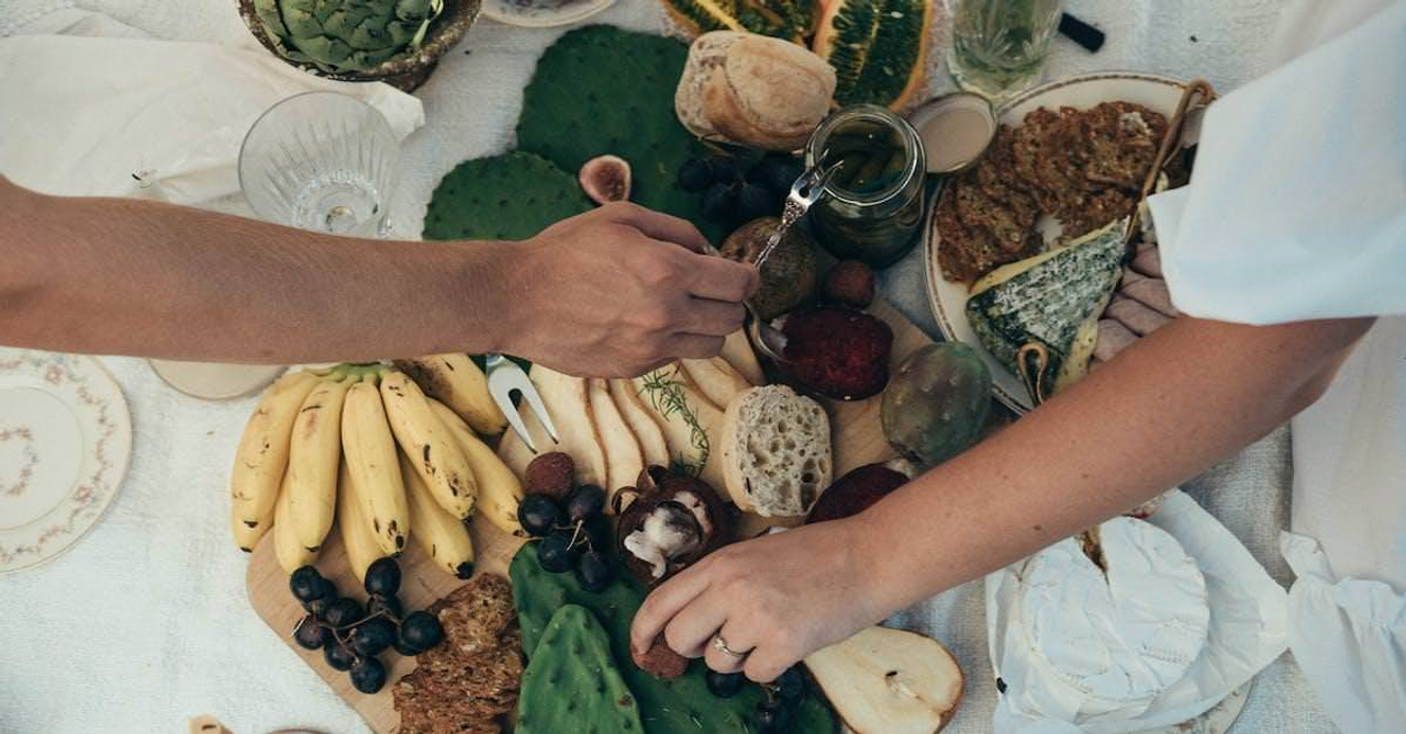 Couple having healthy picnic together in summer